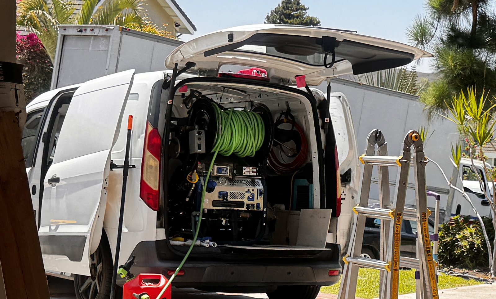 FlowPro IE hydro jetting equipment set up in a driveway before a sewer scope inspection