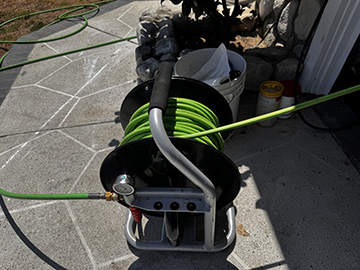 FlowPro IE hydro jetting reel staged at cleanout access on a Rialto CA property