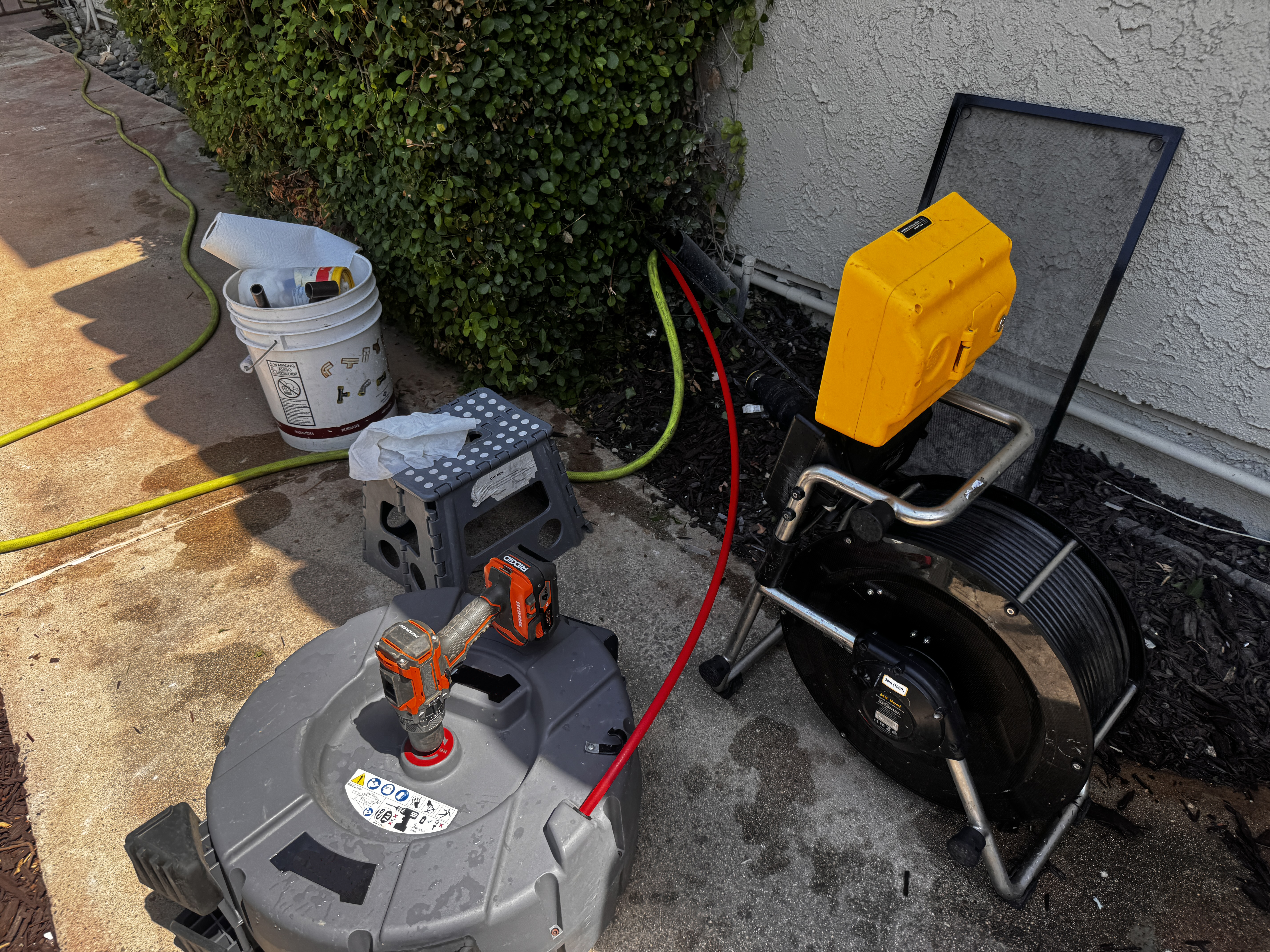 FlowPro camera reel staged at a residential property before a sewer lateral inspection
