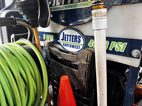 FlowPro IE hydro jetter equipment on-site during a sewer service call in Riverside CA