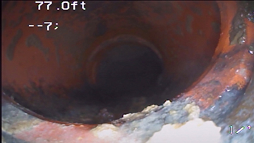 Corroded and offset clay sewer pipe captured at 77 feet during a FlowPro IE sewer scope inspection in San Bernardino CA